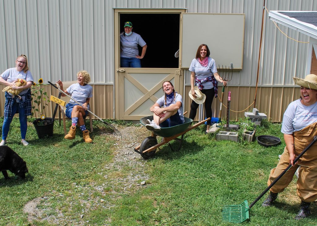 Staff posing outside barn